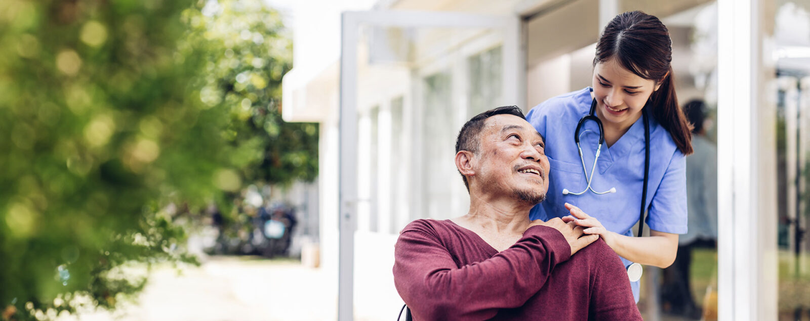 Caregiver nurse take care a Senior patient outside home. Nurse helping senior people